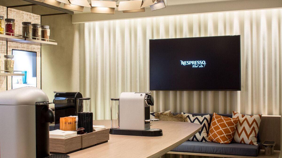 Nespresso Boutiquen werden weltweit mit GästeWLAN von Orange Business Services ausgestattet
